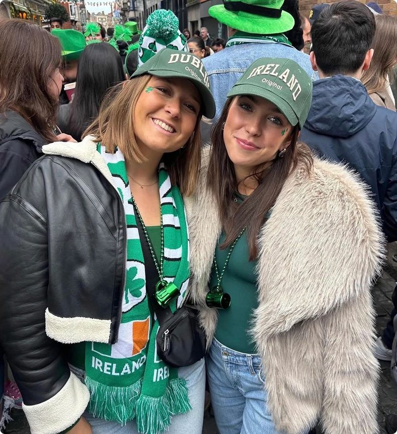Two women celebrating St. Patrick's Day.
