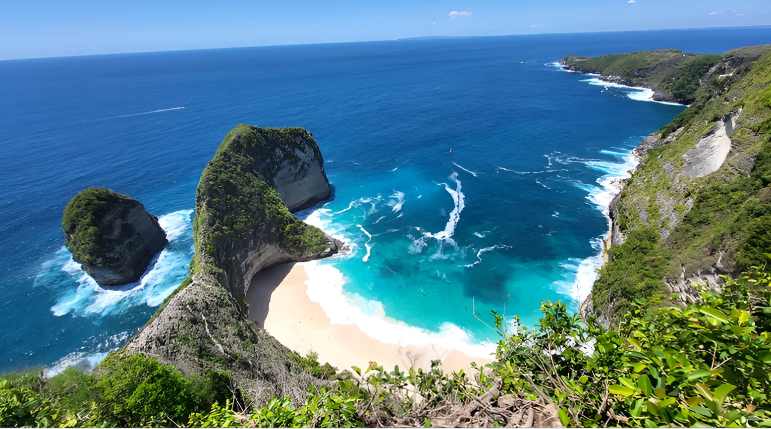 T-rex-shaped cliff and turquoise beach
